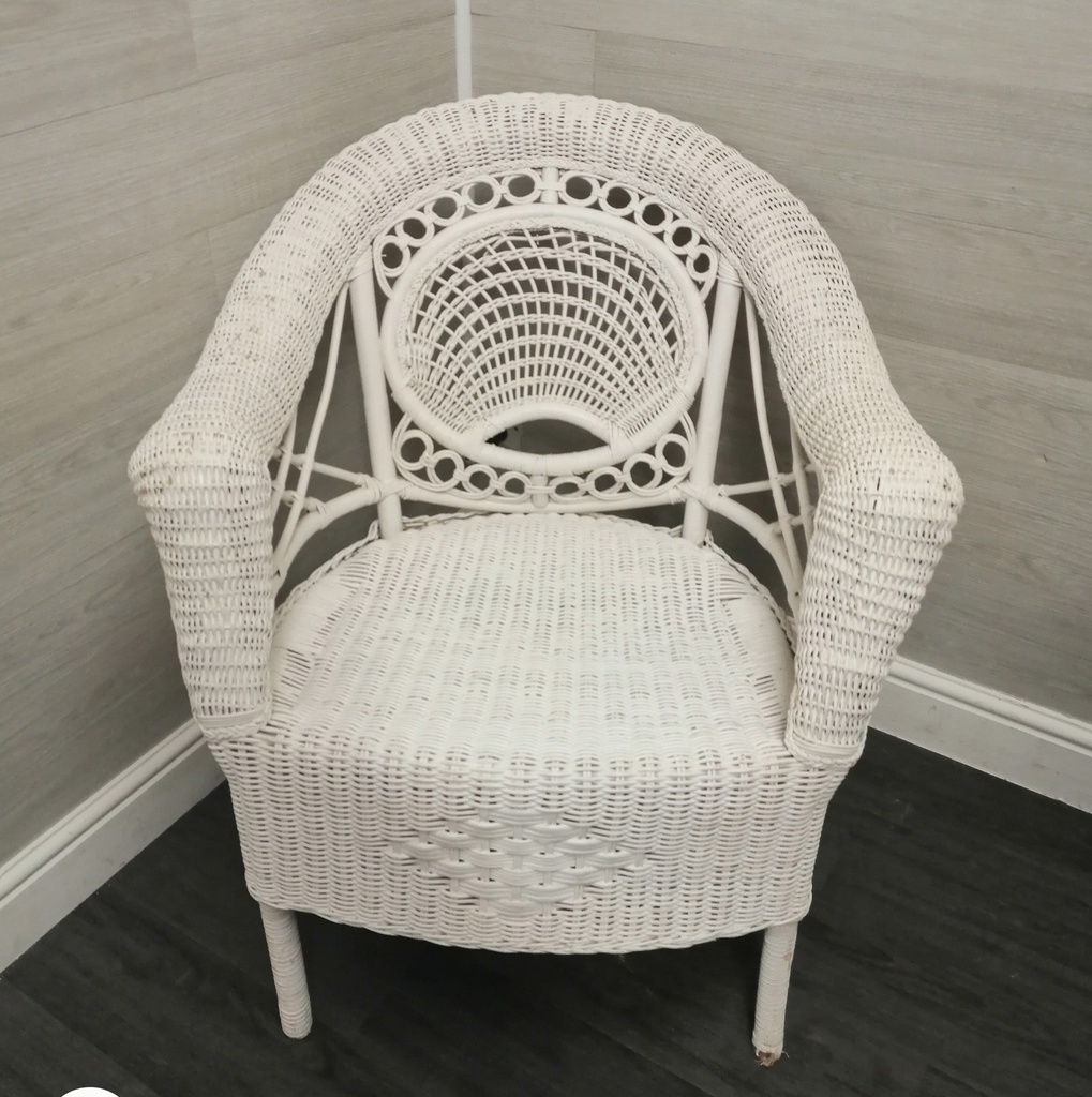 lovely cushioned white wicker armchair