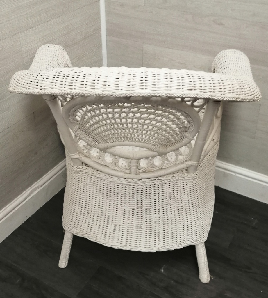 lovely cushioned white wicker armchair